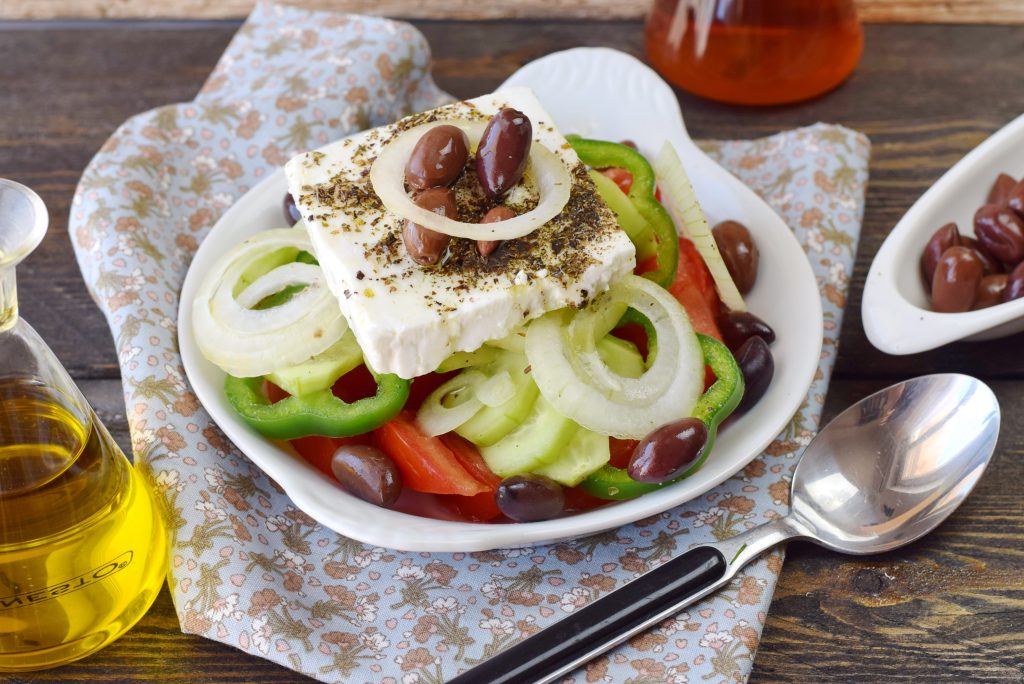 Greek salad with tomato, onion, cucumber, sweet paprika, feta cheese , oregano, vinigar, olive oil and olives