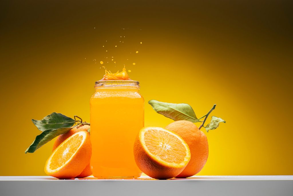 Orange fruits on shelf.