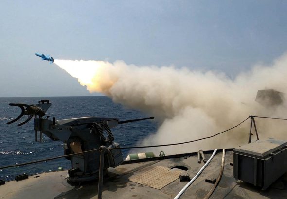 An Iranian missile is launched during a military exercise in an undisclosed location in Iran